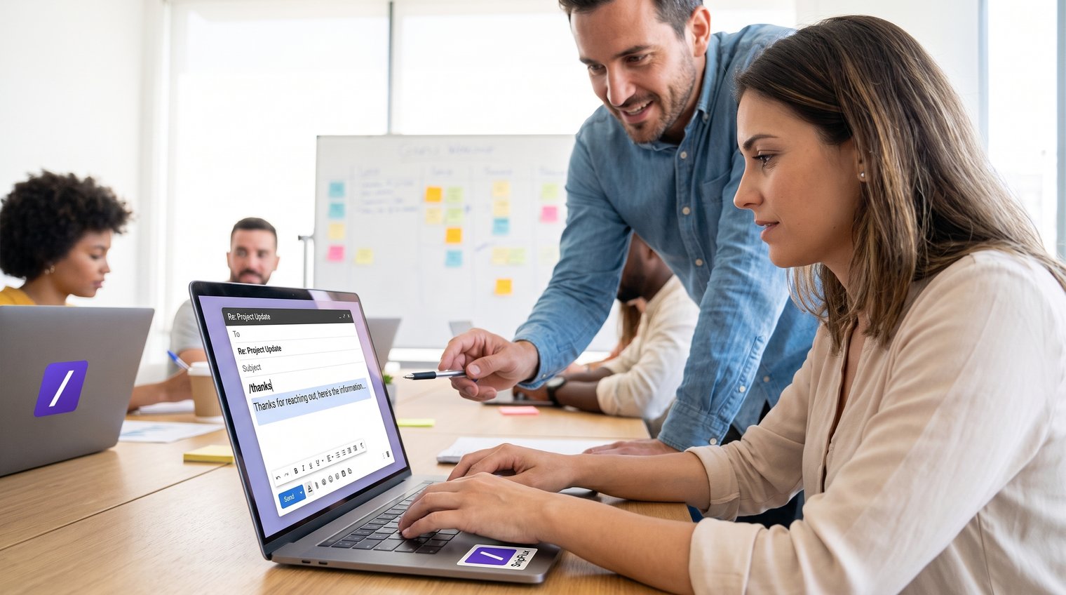 A team member in a live onboarding workshop practicing a customer reply from a shared template while a facilitator provides guidance