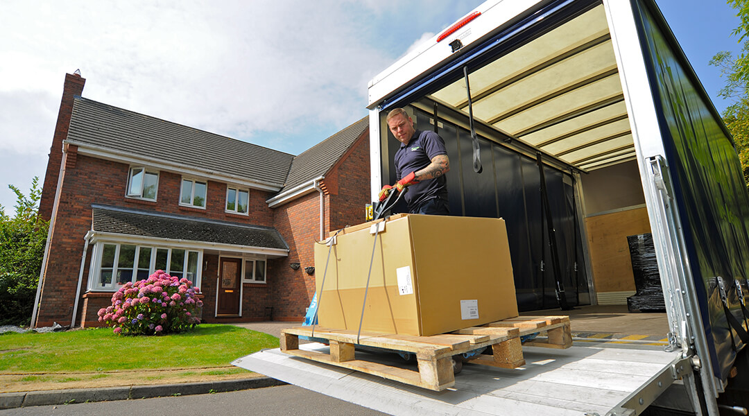 Appliance couriers delivering on a pallet