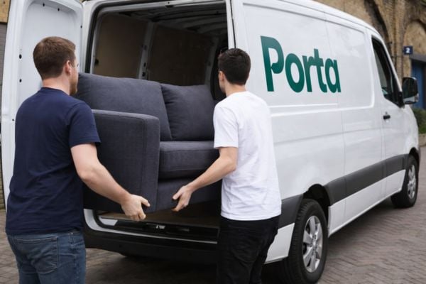 Second hand sofa being delivered by one of Porta Delivery's partnered drivers